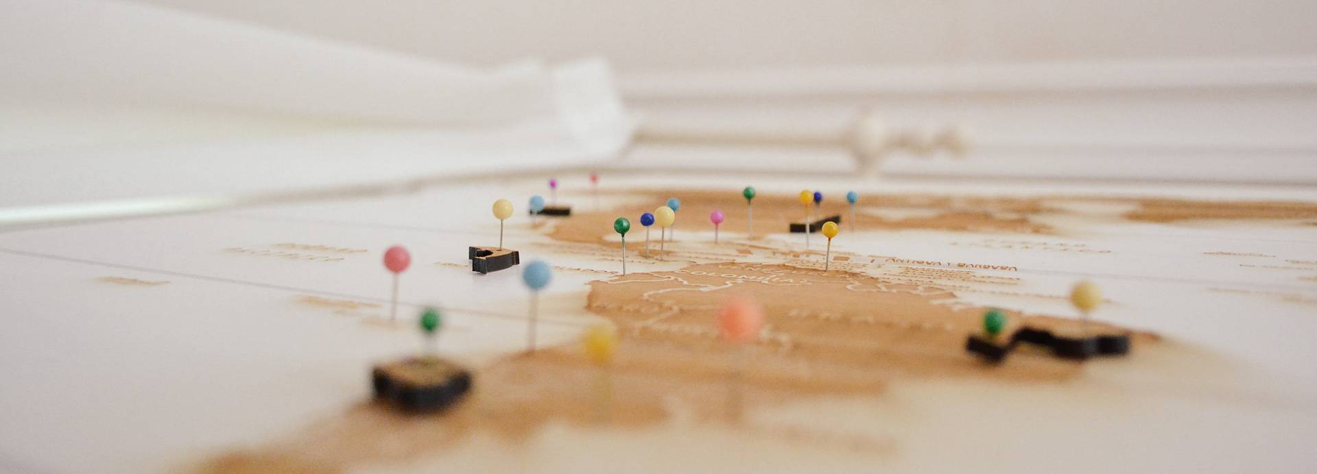 A series of coloured pins show a journey from through South America into the Northern Hemisphere.